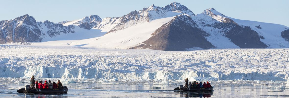 Zodiac cruising near a Greenlandic glacier