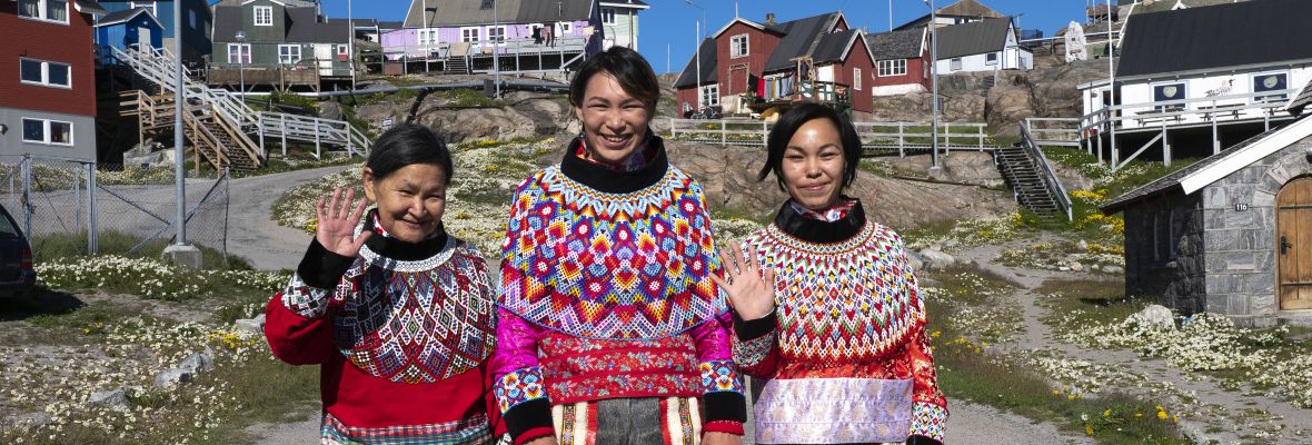 Wonderful people in national dresses giving their greetings