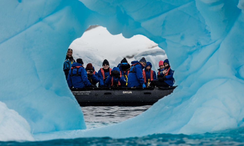 Modern Antarctic explorers enjoy a Zodiac cruise Modern Antarctic explorers enjoy a Zodiac cruise