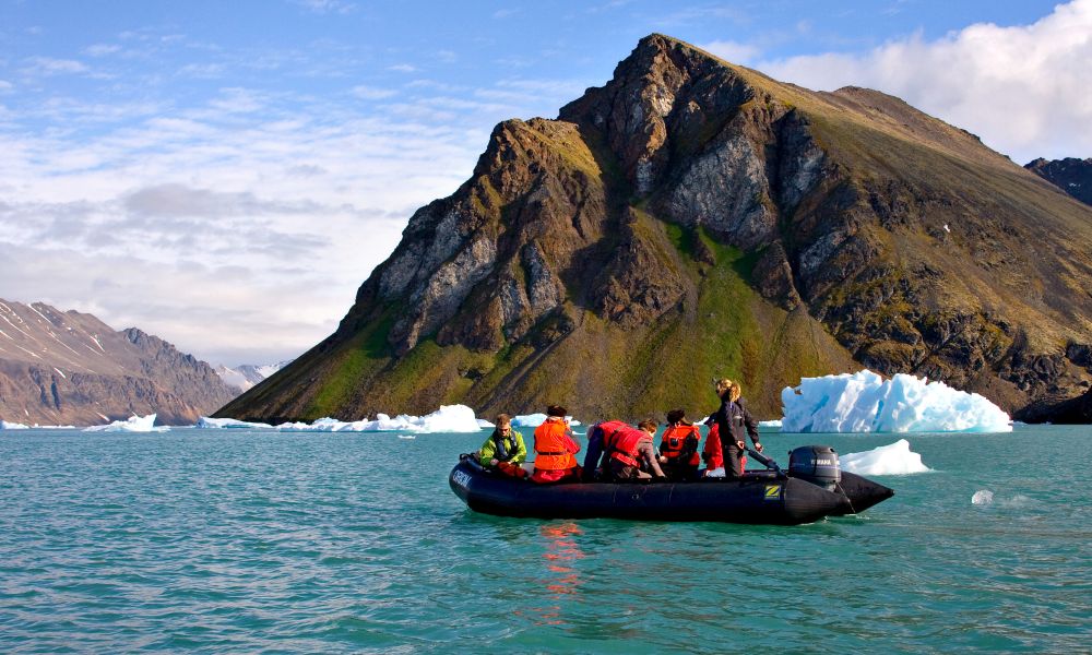 Zodiac cruising in the fjords of Svalbard Zodiac cruising in the fjords of Svalbard