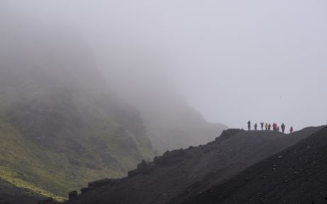 Expedition guests exploring the raw wilderness of Jan Mayen Expedition guests exploring the raw wilderness of Jan Mayen